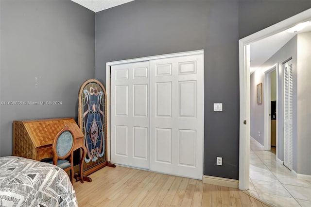 bedroom featuring a closet and light hardwood / wood-style floors