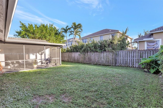 view of yard with a sunroom