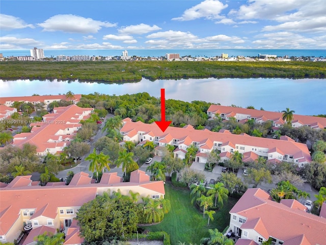 birds eye view of property featuring a water view