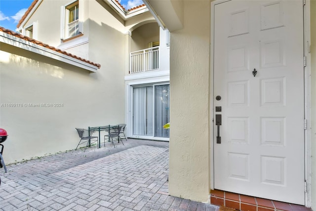 property entrance with a patio