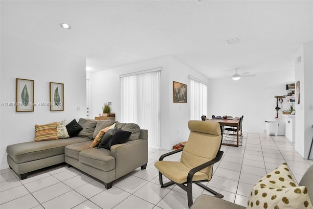 tiled living room featuring ceiling fan