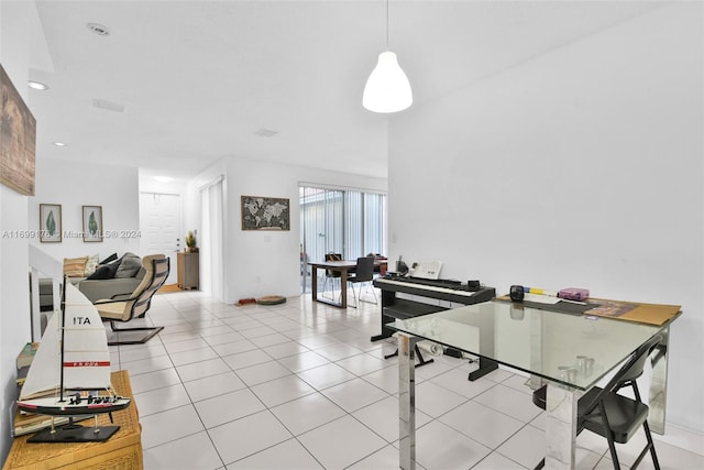 dining space featuring light tile patterned floors