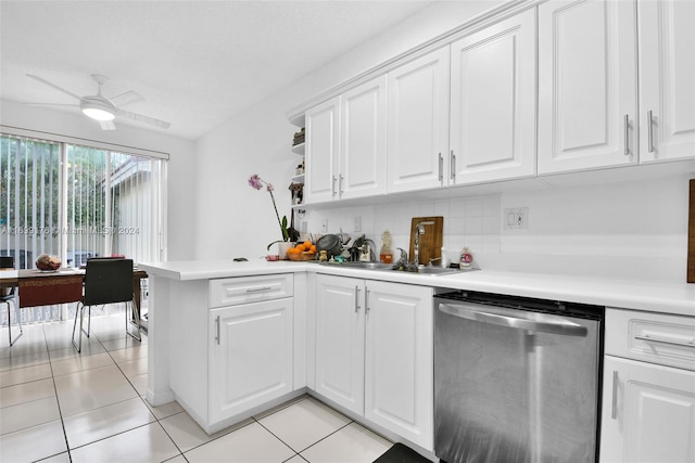 kitchen with ceiling fan, white cabinets, stainless steel dishwasher, and light tile patterned floors