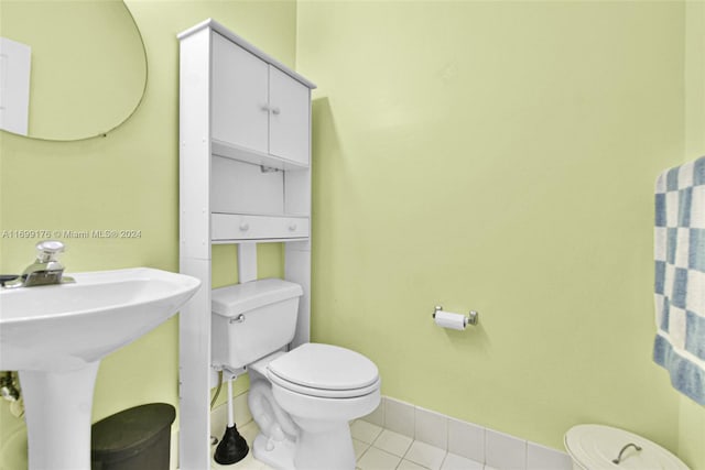 bathroom featuring tile patterned floors, sink, and toilet