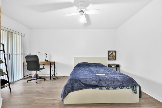 bedroom featuring hardwood / wood-style flooring and ceiling fan