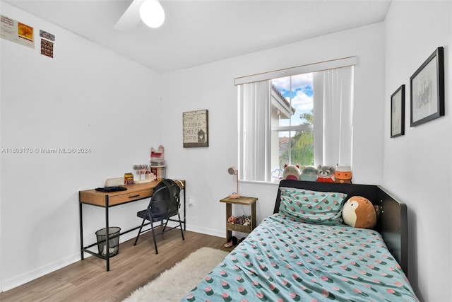 bedroom featuring light hardwood / wood-style flooring and ceiling fan