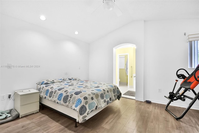 bedroom featuring ceiling fan, wood-type flooring, and lofted ceiling