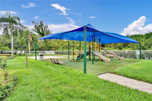 view of jungle gym featuring a lawn