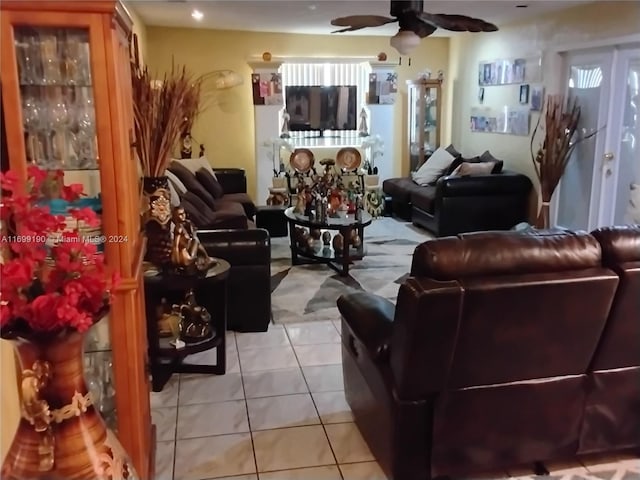 tiled living room featuring ceiling fan