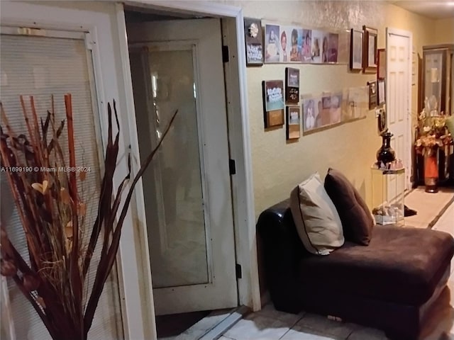 hallway featuring light tile patterned floors