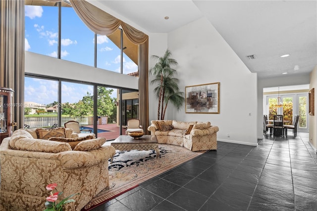 living room with a towering ceiling