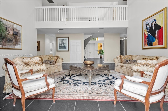 living room featuring a towering ceiling