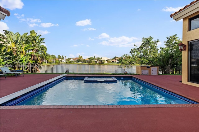 view of pool featuring a deck with water view