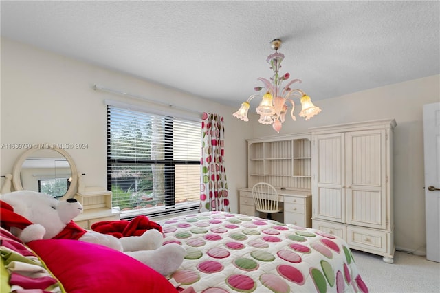 bedroom featuring light carpet, a textured ceiling, and a notable chandelier