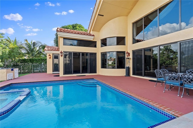 view of swimming pool featuring a patio area