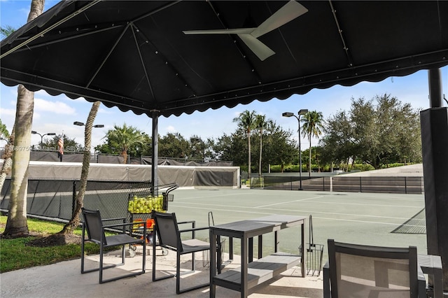 view of tennis court with ceiling fan