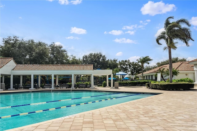 view of pool featuring a patio area