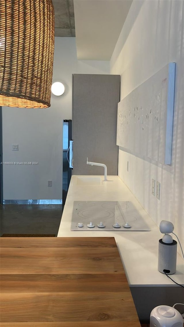 kitchen featuring sink and white electric stovetop