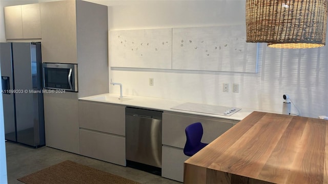 kitchen with sink and appliances with stainless steel finishes