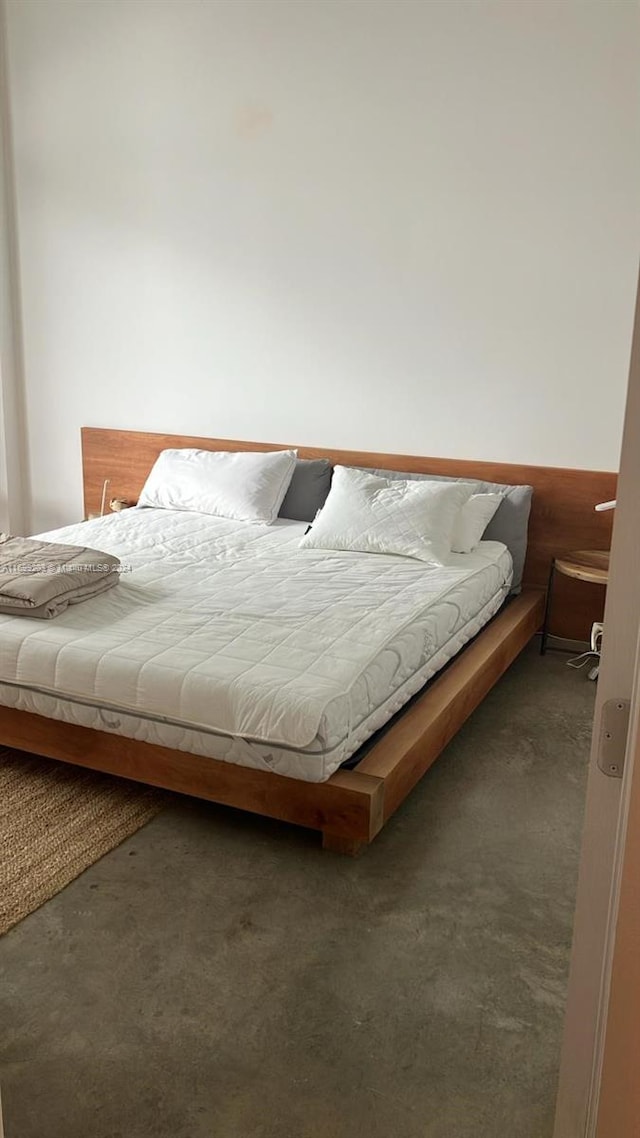 bedroom featuring dark colored carpet