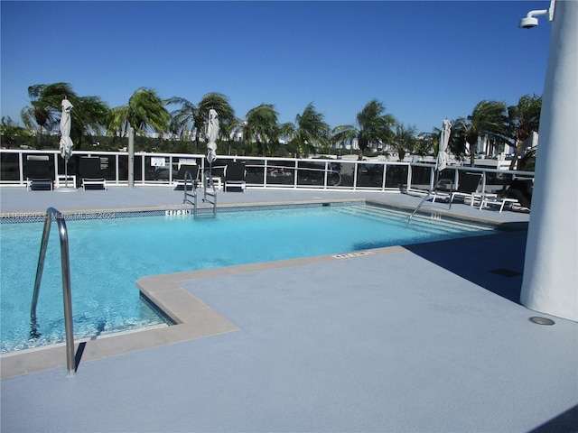 view of swimming pool with a patio area