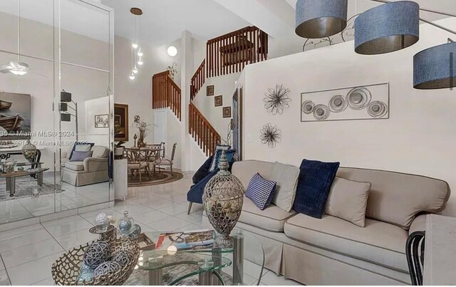 671SW 158th Way, Pembroke Pines, FL 33027 - living room with tile patterned floors, a high ceiling, and stairway