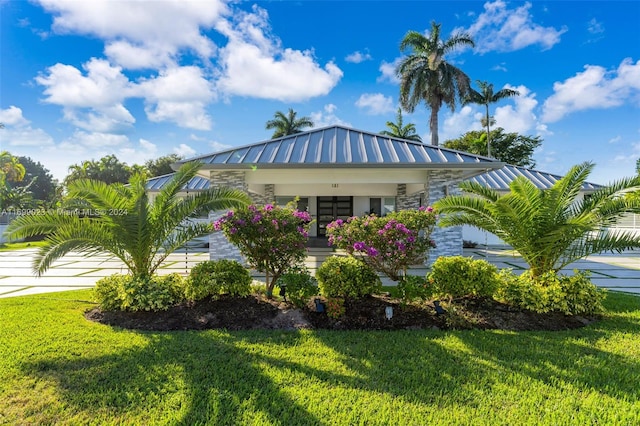10 SW 124th Ave, Miami, FL 33184 - view of front of home with a standing seam roof, a front yard, and stone siding