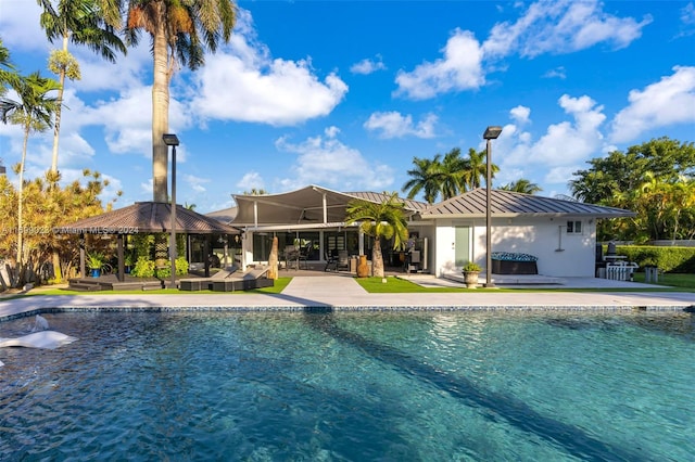 view of swimming pool with a gazebo, a jacuzzi, outdoor lounge area, and a patio