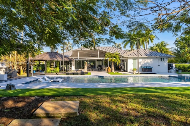 view of pool featuring a lawn and a patio area