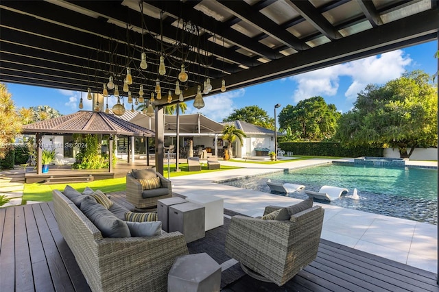 exterior space featuring a gazebo, an outdoor living space, pool water feature, and a deck