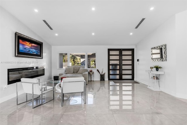 living room featuring lofted ceiling