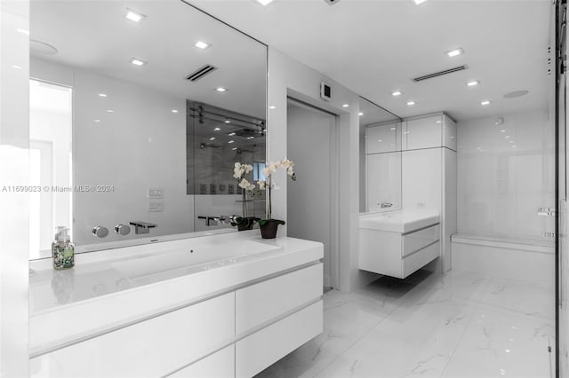 10 SW 124th Ave, Miami, FL 33184 - bathroom with two vanities, marble finish floors, a stall shower, and recessed lighting