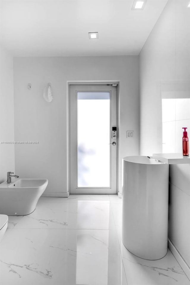 10 SW 124th Ave, Miami, FL 33184 - bathroom featuring a bidet, toilet, and marble finish flooring