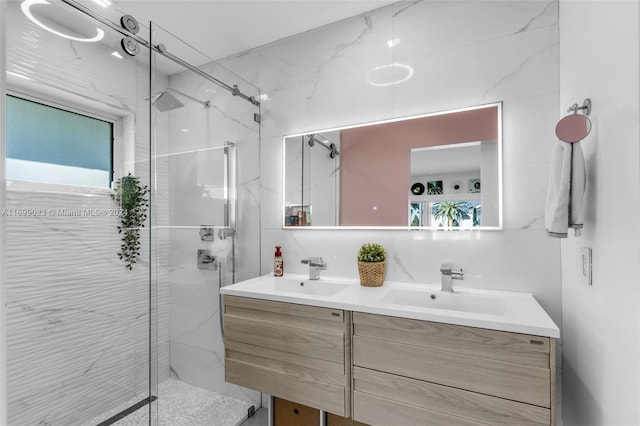 bathroom featuring vanity and a shower with shower door