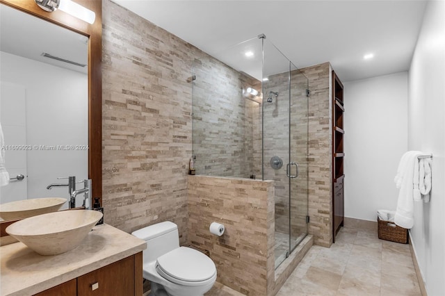 bathroom with vanity, toilet, and walk in shower