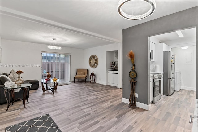 sitting room featuring light hardwood / wood-style floors