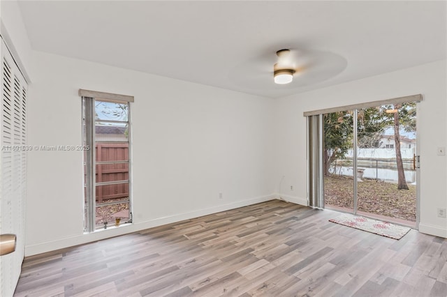 empty room with light hardwood / wood-style floors