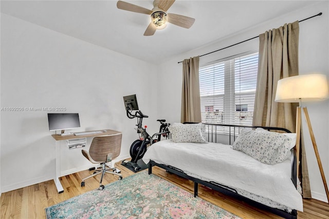 bedroom featuring ceiling fan and hardwood / wood-style flooring