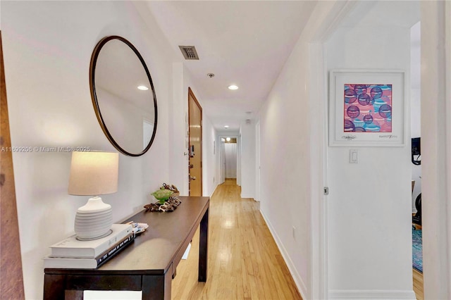 802 Euclid Ave Unit 302, Miami Beach, FL 33139 - hallway with light wood-type flooring, baseboards, visible vents, and recessed lighting