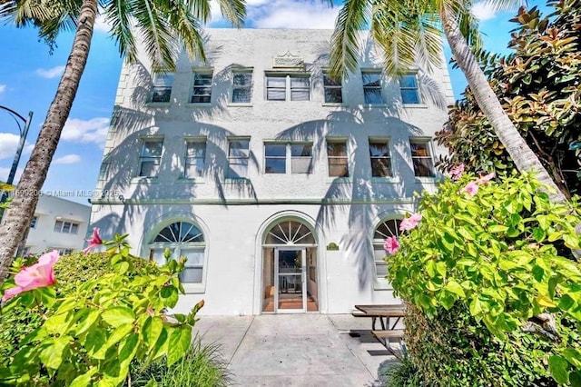 view of front of house with a patio area