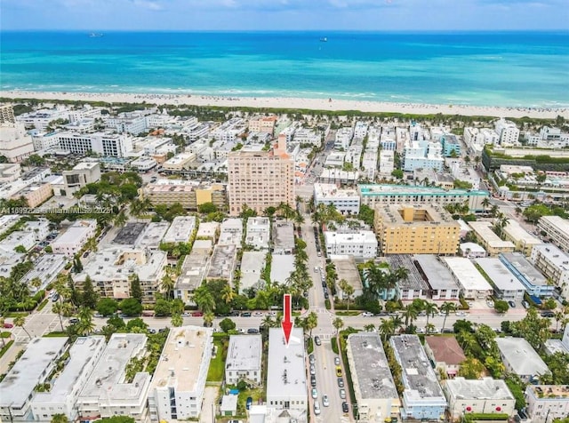 drone / aerial view with a view of the beach and a water view