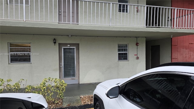 property entrance with a balcony