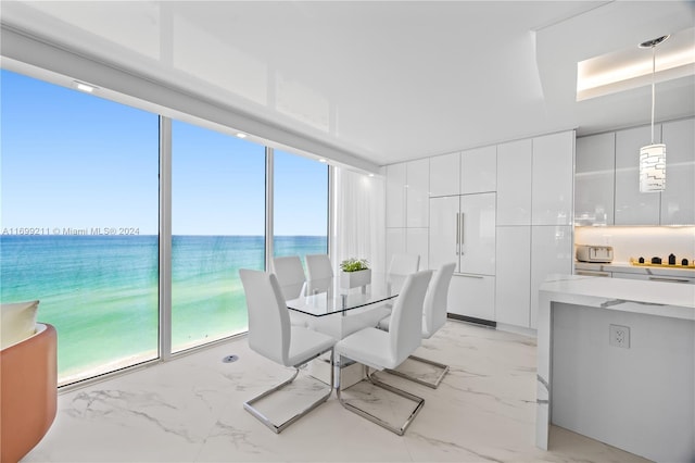 16445 Collins Ave Unit 1126, Sunny Isles Beach, FL 33160 - dining room featuring light marble finish floors and a water view
