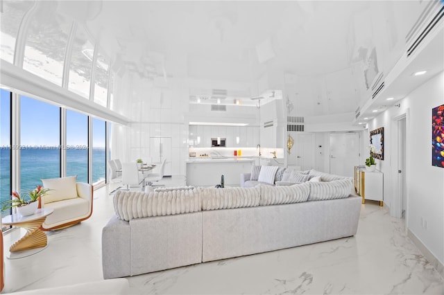16445 Collins Ave Unit 1126, Sunny Isles Beach, FL 33160 - living room with a high ceiling, marble tiled flooring, and a water view