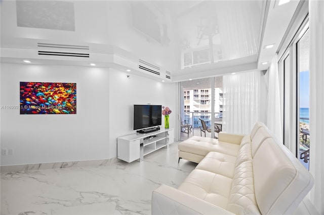 16445 Collins Ave Unit 1126, Sunny Isles Beach, FL 33160 - living area featuring marble finish flooring, a high ceiling, baseboards, and recessed lighting