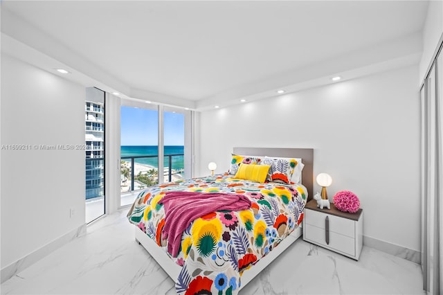 16445 Collins Ave Unit 1126, Sunny Isles Beach, FL 33160 - bedroom featuring a water view, marble look tile flooring, baseboards, recessed lighting, and access to exterior