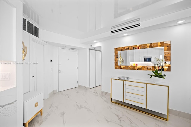 16445 Collins Ave Unit 1126, Sunny Isles Beach, FL 33160 - entrance foyer with light marble finish floors, recessed lighting, and a high ceiling