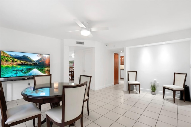 dining area featuring ceiling fan and light tile patterned floors