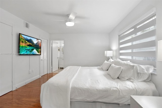 bedroom featuring wood-type flooring and ceiling fan