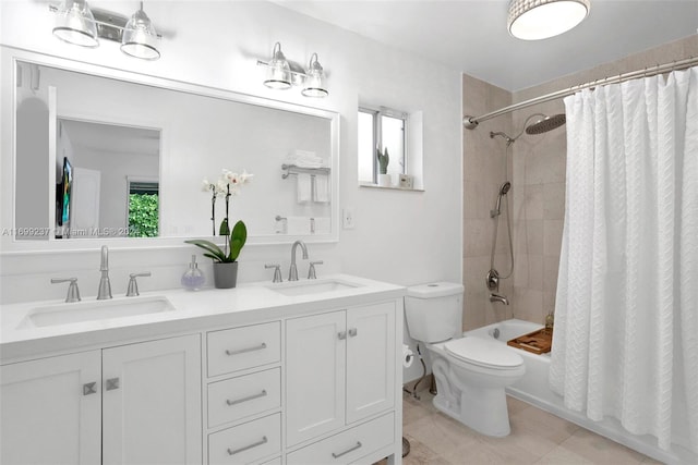 full bathroom featuring tile patterned floors, vanity, shower / bathtub combination with curtain, and toilet